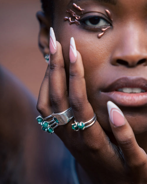 RAFU APPU Rack & Stack collection rings out of emerald, gold and silver.