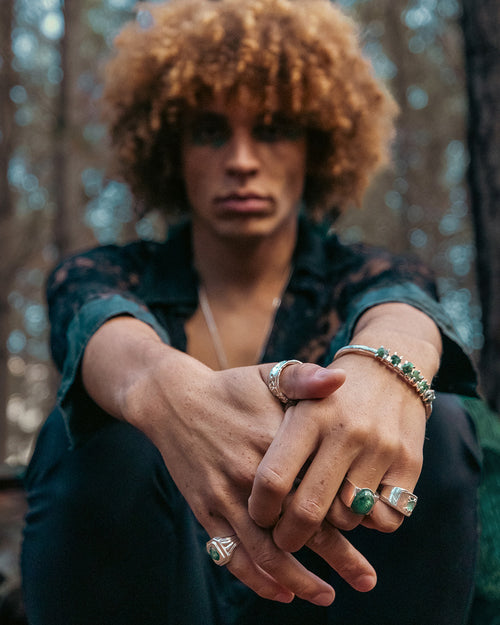 Handsome style with emerald and silver rings and cuffs from the Regal Rebel collection by RAFU APPU.